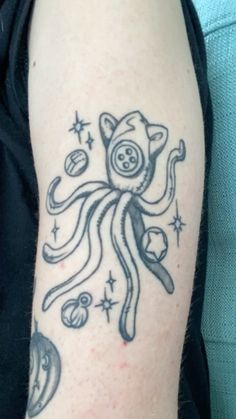 an octopus tattoo on the left arm