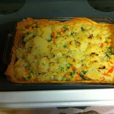 a casserole dish sitting on top of an oven