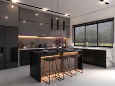 a modern kitchen with marble counter tops and bar stools in front of the window