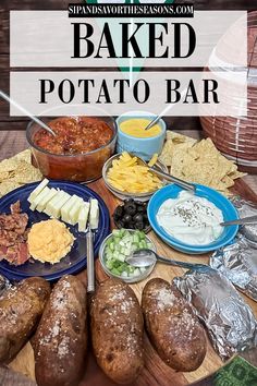 baked potato bar on a wooden table with chips and dips