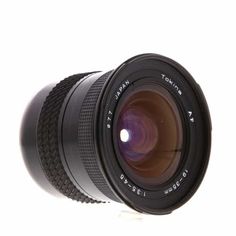 a camera lens sitting on top of a white surface