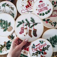 someone is stitching christmas stockings and stockings on their hand embroidery hoops with the words merry christmas