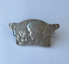 A charming Murrle Bennett silver brooch. C1900-1910. Surprisingly well marked for Murrle Bennett with the MB & Co surprisingly clear. ( I was beginning to believe they only had the one stamp , most are so faint). Also marked with post 1886 German silver marks.for 950 grade silver. (slightly higher than sterling)  Size 39mm max width & 21mm height. Weight 7gms Collectible Art Nouveau Hallmarked Brooch, Silver Art Nouveau Brooch, Silver Art Nouveau Brooches As Gift, Silver Art Nouveau Brooches For Gifts, Mother Child, German Silver, Silver Brooch, Mother And Child, Favorite Jewelry