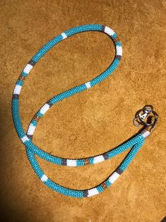 I am a First Nation person and I do live in Northern BC, Canada. I am Gitxsan on my mother’s side and Cree on my fathers. - Perfect for work, teachers, nurses, conferences.- A wrap beaded lanyard made with size 10/0 glass Czech seed beads, paracord, 25mm nickel hook and split ring. lanyard length: 18 inches ~Lanyard diameter: 32 inches ~SHIPMENT Standard shipment DOES NOT include tracking.Shipments are made every Monday and Friday.Shipped with bubble wrap. Express shipping option is shipped ASAP Native Beaded Lanyards, Native American Lanyards, Lanyard Patterns, Black Beaded Lanyards Native American, Adjustable Blue Beaded Lanyards, Green Beaded Lanyards Native American, Lanyard Ideas, Raw Leather, Ribbon Skirts