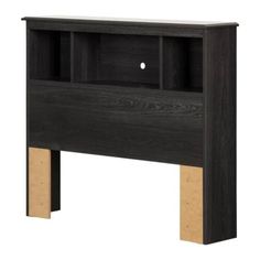 a black bookcase with wooden legs and an open shelf