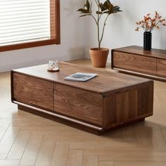 two wooden coffee tables sitting on top of a hard wood floor