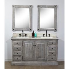 two mirrors are above the double sink vanity