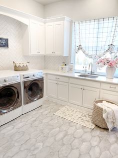 a washer and dryer in a white kitchen