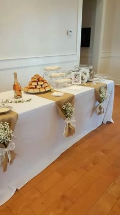 the table is set up with desserts and pastries for guests to take home