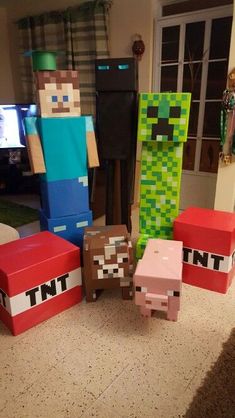 several minecraft characters sitting in front of a tv