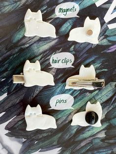 the hair clips are labeled with different types of cat's head and tail shapes