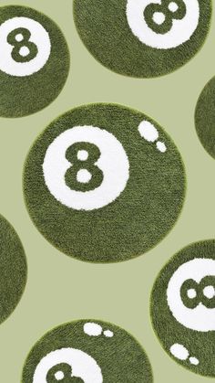 eight ball rugs with white numbers and green grass in the shape of an eight