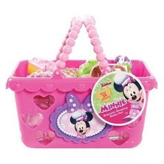 a pink basket with minnie mouse toys in it