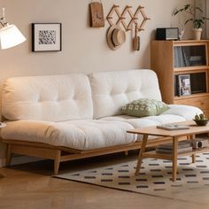 a living room with a white couch and coffee table