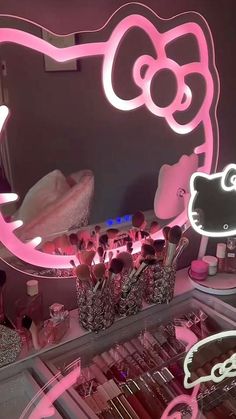 a hello kitty lighted vanity mirror with makeup brushes