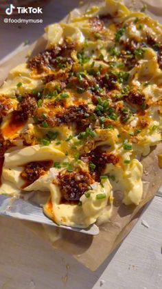 a close up of a plate of food with broccoli and cheese on it