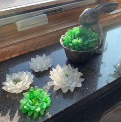 some fake flowers sitting on top of a counter