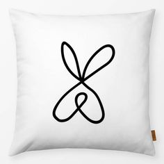 a black and white pillow with the letter k in it's center on a white background