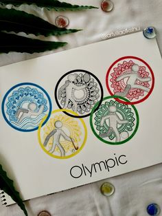 an olympic poster with four symbols on it