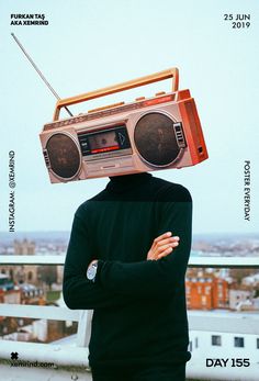 a man with a boombox on his head standing in front of a cityscape