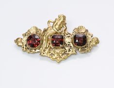 G. Accarisi Firenze Garnet Cherub Brooch.Antique 18K yellow gold cherub brooch/pin with rubies, signed G. Accarisi Firenze. Approximate Measurements: Length 2.1", Width 1.2" Weight: 11 Grams. Made in: Italy. Garnet And Gold, Genuine Love, Vintage Watches, Antique Jewelry, Brooch Pin, Vintage Antiques, Garnet, Jewelry Watches, Ruby