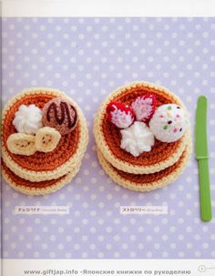 two small crocheted plates with food on them