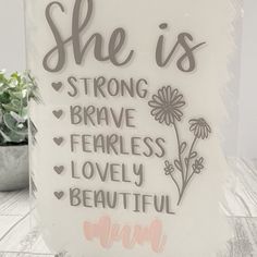 a glass block that says she is strong brave fearless lovely beautiful woman