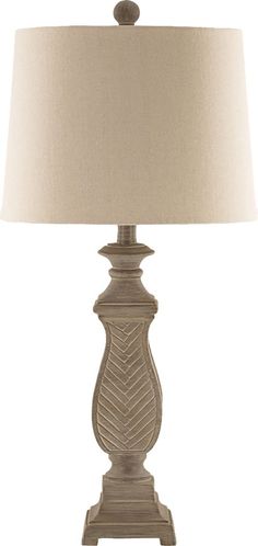 a table lamp with a beige shade on the base and a white lampshade