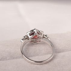 ◆The ring draws inspiration from the polaris. Hand-finished in Sterling sliver, this piece features a round shaped garnet . Clear zirzons decorate around the main stone. An extremely simple celestial ring that you cannot miss. ◆ Production Description: Main stone Type: Garnet Main Stone Shape: Round Main Stone Size:7*7mm(1.68ct) Side stone: CZ Metal: 925 Sterling silver - Other options available in the drop down menu ◆ Customization: √Free for Add Engraving √Other Metal Type Available √Other Gem Fine Jewelry Garnet Cluster Ring, Fine Jewelry Round Cluster Ring With Garnet, Garnet Birthstone Cluster Ring, Garnet Gemstone Cluster Ring, Garnet Cluster Ring As A Gift, Silver Ruby Ring With Diamond Bezel Setting, July Birthstone Ring, Green Sapphire Ring, Red Garnet Ring