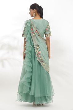 Powder green organza dola padded blouse with multi-colored resham flowers, zardosi and aari embroidery. Comes with an organza lehenga and a detachable drape. - Aza Fashions Pista Green Choli With Floral Embroidery For Party, Transitional Organza Dress For Reception, Transitional Reception Dress In Organza, Designer Wear Pista Green Organza Choli, Pista Green Organza Choli With Sheer Dupatta, Bollywood Style Pista Green Organza Pre-draped Saree, Green Organza Choli With Resham Embroidery, Green Organza Blouse Piece For Reception, Green Organza Blouse Piece For Wedding