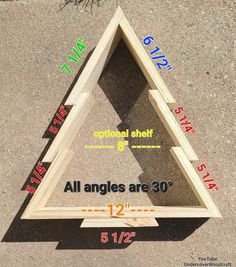 a wooden triangle with the measurements for all angles are 30cm high and 12cm wide