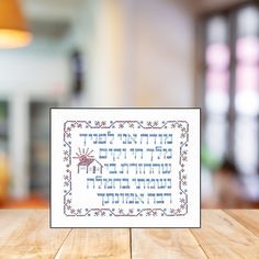 a cross - stitch card with the words happy hanukkah written on it