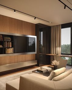 a modern living room with large windows and bookshelves on the wall, along with an entertainment center