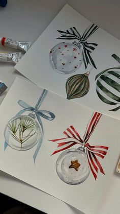 three christmas cards with ornaments on them