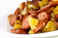 closeup of cooked sausage and potatoes on a plate