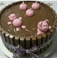 a chocolate cake with pigs in the middle