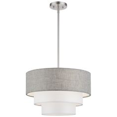 a light fixture with a grey shade on the top and white fabric around it's edges