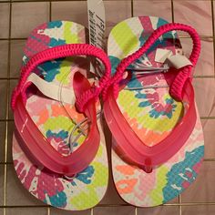 The Children’s Place Super Cute Multicolored Toddler Flip Flop Sandals Playful Non-slip Flip Flops For Spring, Playful Summer Flip Flops For Playtime, Summer Playful Style Flip Flops, Playful Multicolor Flip Flops For Vacation, Fun Non-slip Flip Flops For Spring, Playful Adjustable Multicolor Flip Flops, Pink Non-slip Flip Flops For Spring, Pink Non-slip Spring Flip Flops, Pink Playful Flip Flops For Spring