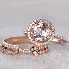 two rose gold wedding rings with an oval morganite surrounded by diamonds