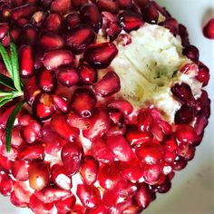 the pomegranate has been cut in half and is ready to be eaten