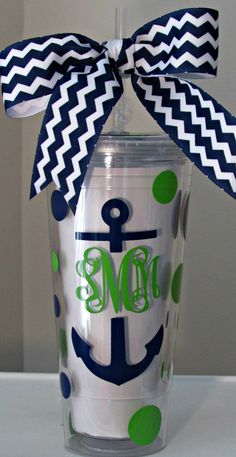 the monogrammed tumbler is decorated with an anchor and polka dot ribbon on it