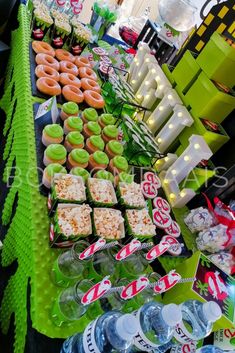 a table filled with lots of different types of food and drinks on top of it