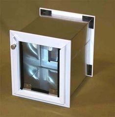 a small white box that is open on the floor and has a window in it