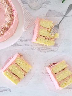 four slices of cake sitting on top of plates next to a fork and glass bowl