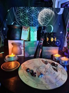 a table topped with lots of candles and cards