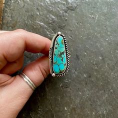 Handmade Hubei Turquoise and sterling silver statement ring.  -Ring will fit US size 9 Vintage American Southwest style design.  Beautiful and unique Hubei Turquoise in lovely teal-blue,  with unique black matrix and a hint of yellow halo too. Stamped border and twisty rope design, high polish finish.  Chunky Double split style ring shank/band. Hand stamped Indian style Arrow and Rising Sun Hallmark on backside. Turquoise stone is from the Hubei provence.   100% Sterling silver. ---------------- Thrift Manifestation, Hubei Turquoise, Big Ring, Ring Shank, American Southwest, Big Rings, Statement Ring Silver, Southwest Style, Paper Jewelry