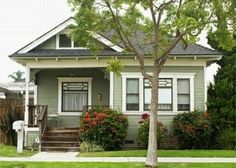 a house with green siding and white trim