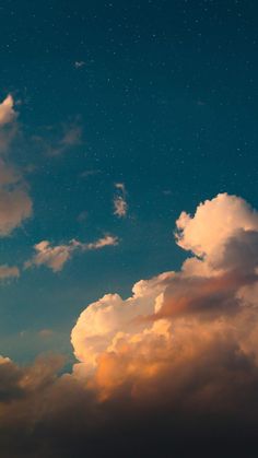 the sky is filled with clouds and stars