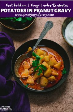 potatoes in peanut gravy served in a bowl with sour cream on the side