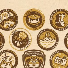 a bunch of badges that are on the side of a wall with dogs and other things in them